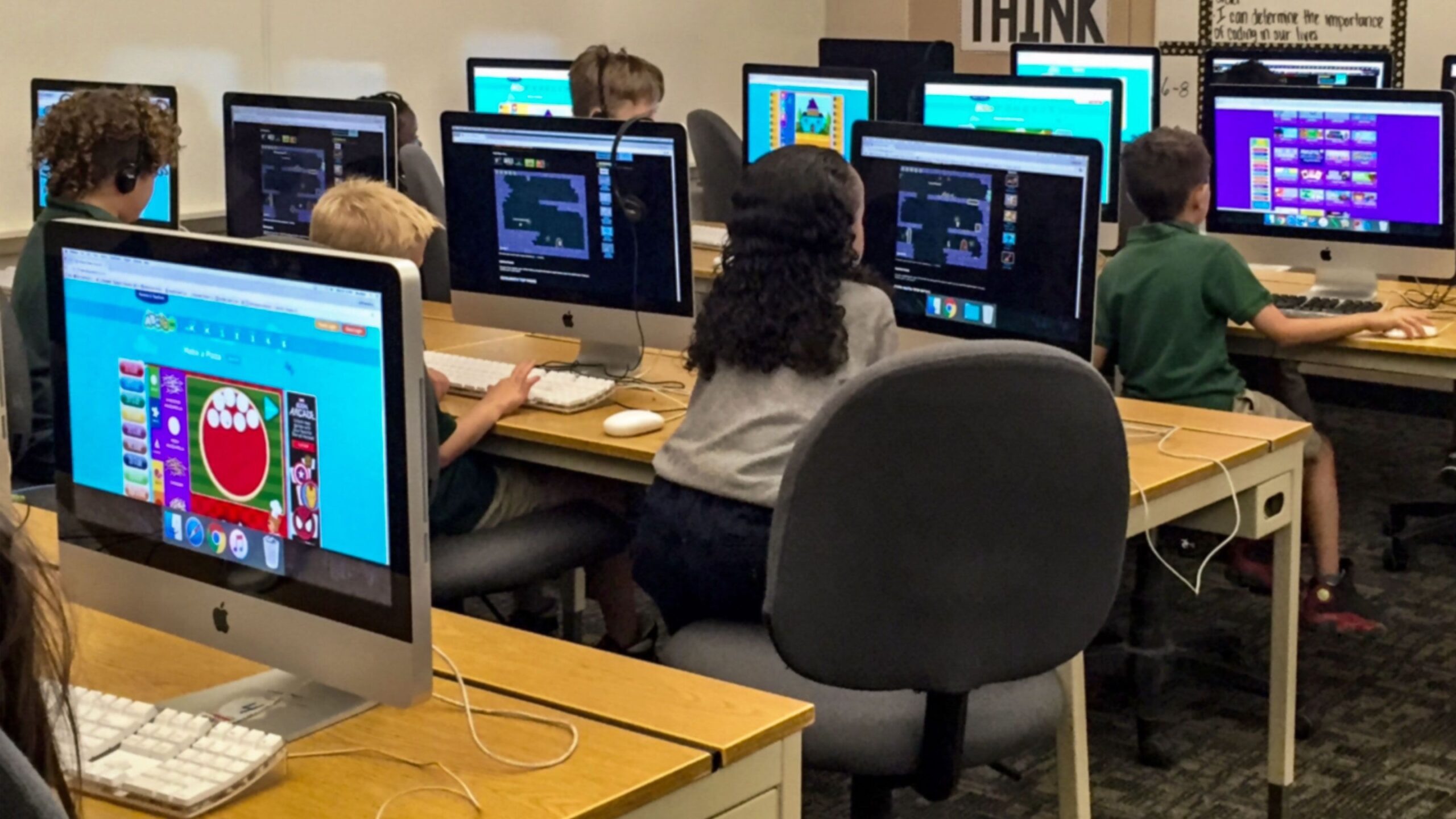 students learning coding in their desktops